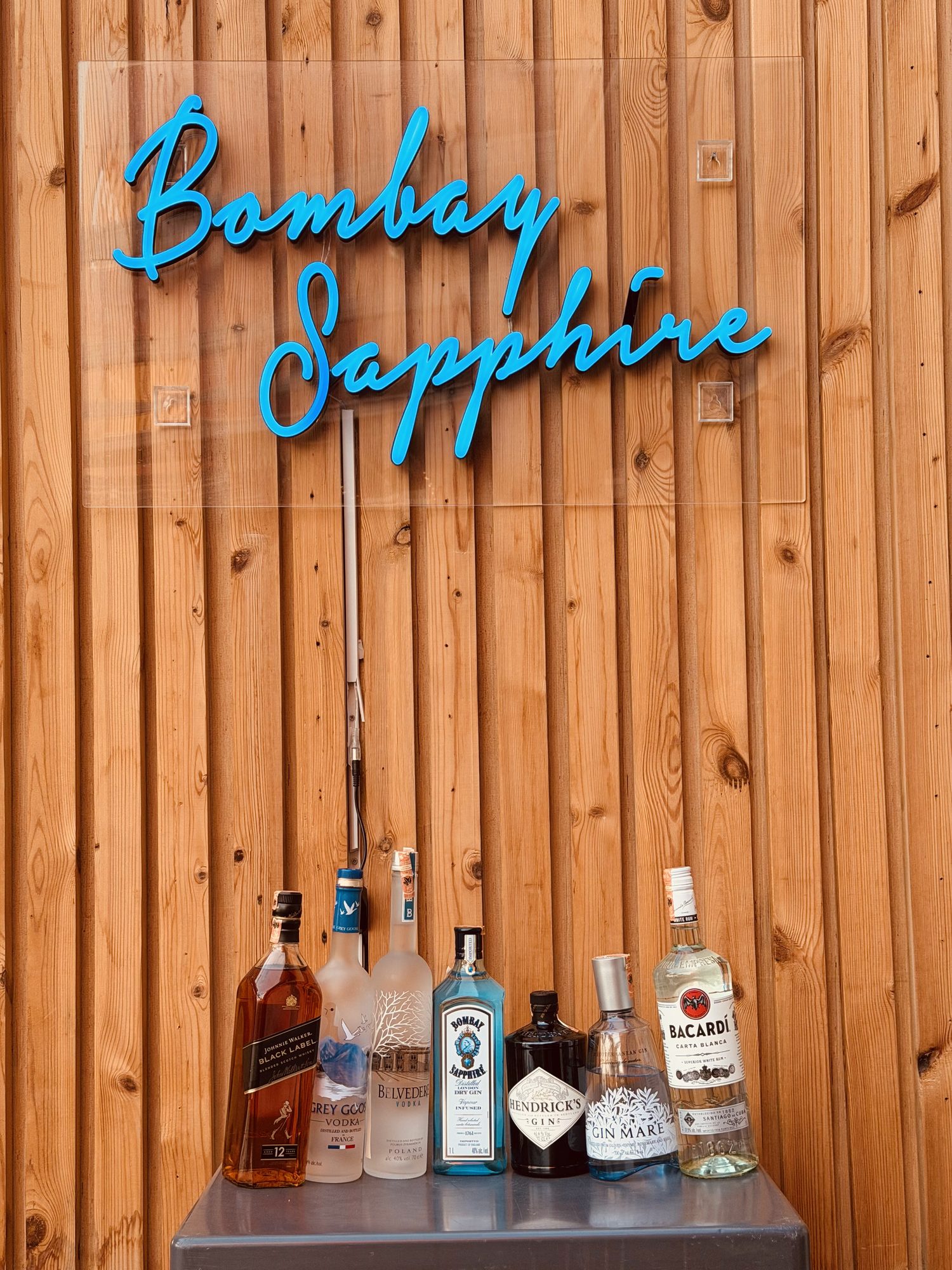 Premium spirit bottles including Bombay Sapphire at Mojo Cocktail Bar